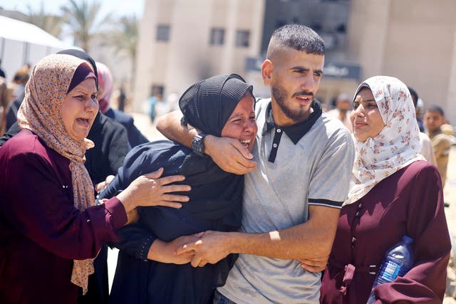 <p>Grieving crowds gather outside Nasser Hospital after the Israeli attack </p>