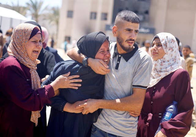 <p>Grieving crowds gather outside Nasser Hospital after the Israeli attack </p>