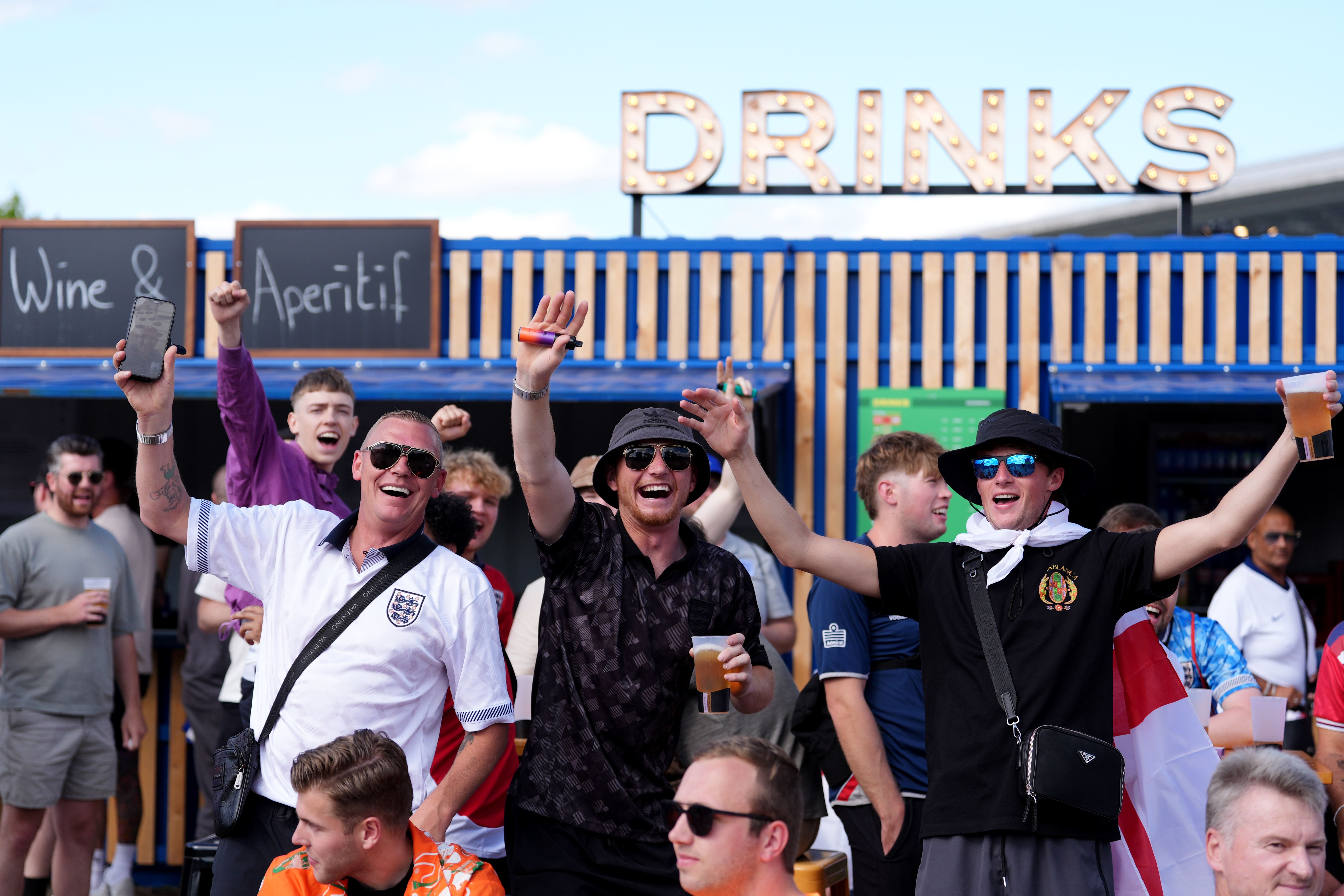 England fans enjoy a drink in Berlin (Bradley Collyer/PA)