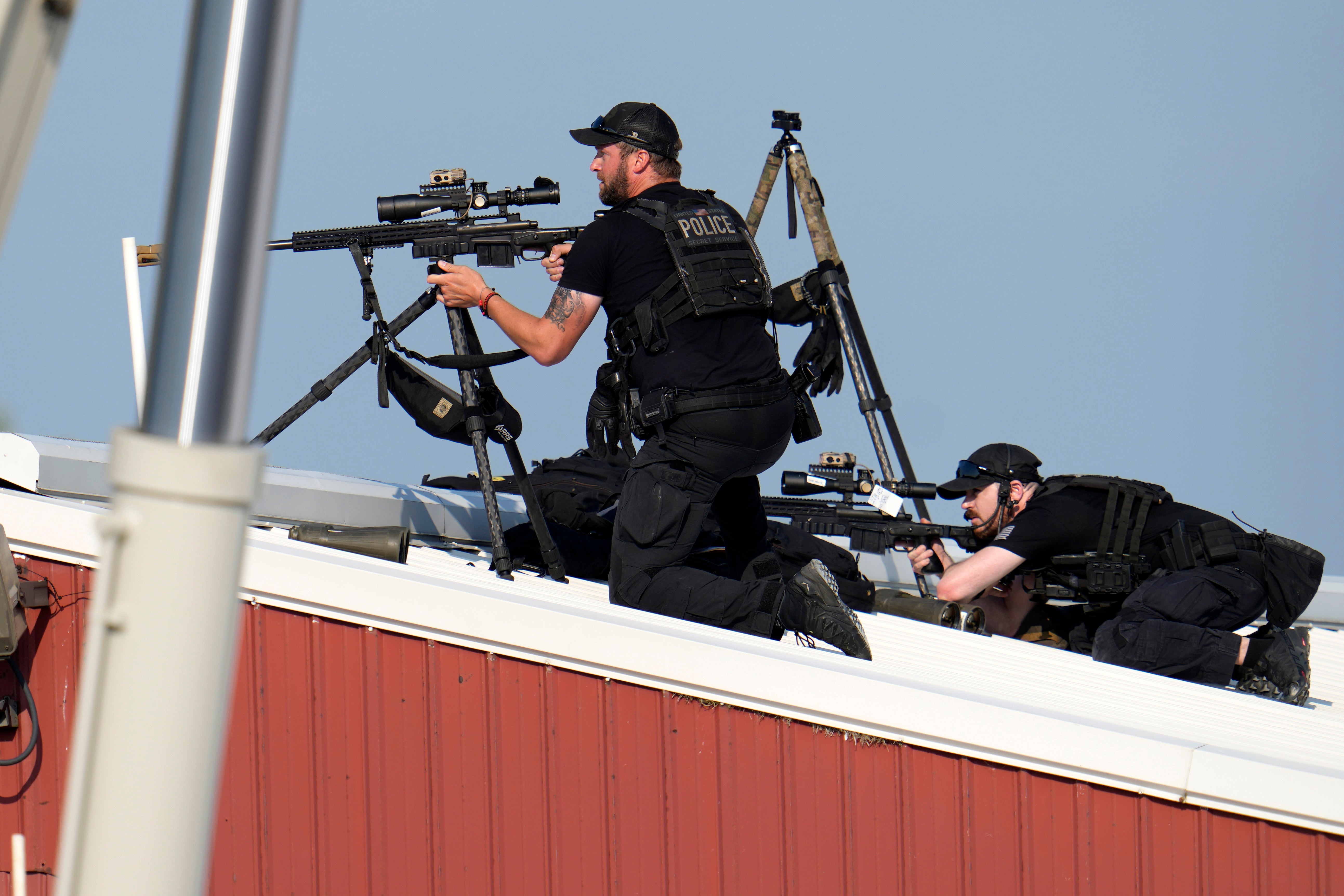 Police snipers return fire after shots were fired while Republican presidential candidate former President Donald Trump was speaking at a campaign event on July 13. Before Trump was set to take the stage in Butler, Pennsylvania, the Secret Service assigned local law enforcement agents to post up on several buildings around the rally area. But crucially, they excluded the warehouse building north of the stage where the gunman would later shoot from.