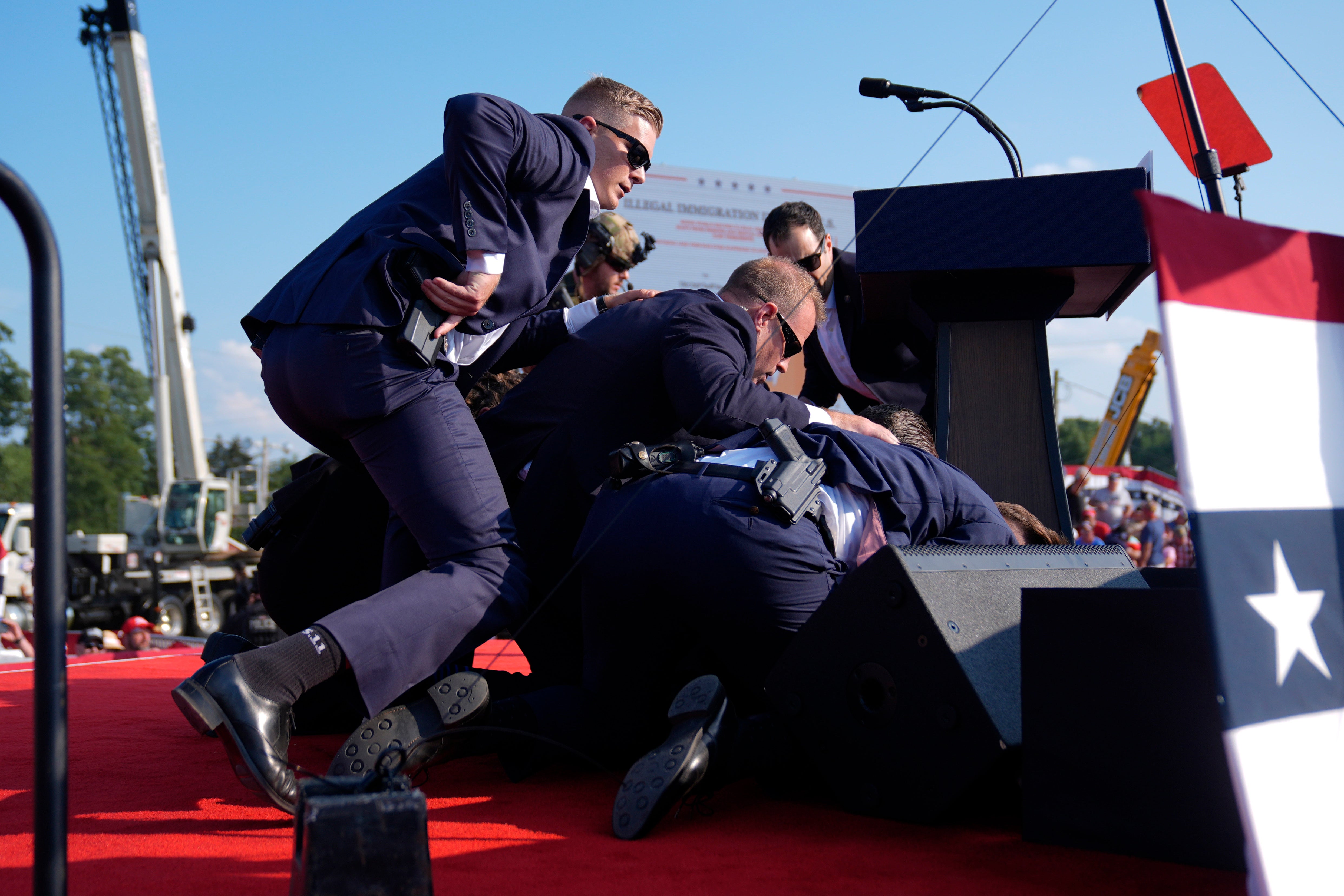 Donald Trump was covered by Secret Service agents after the shots rang out