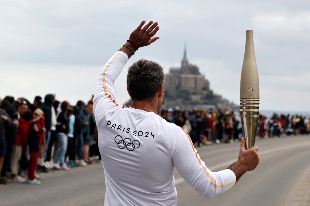 France’s Bastille Day parade meets the Olympic torch relay in an exceptional year