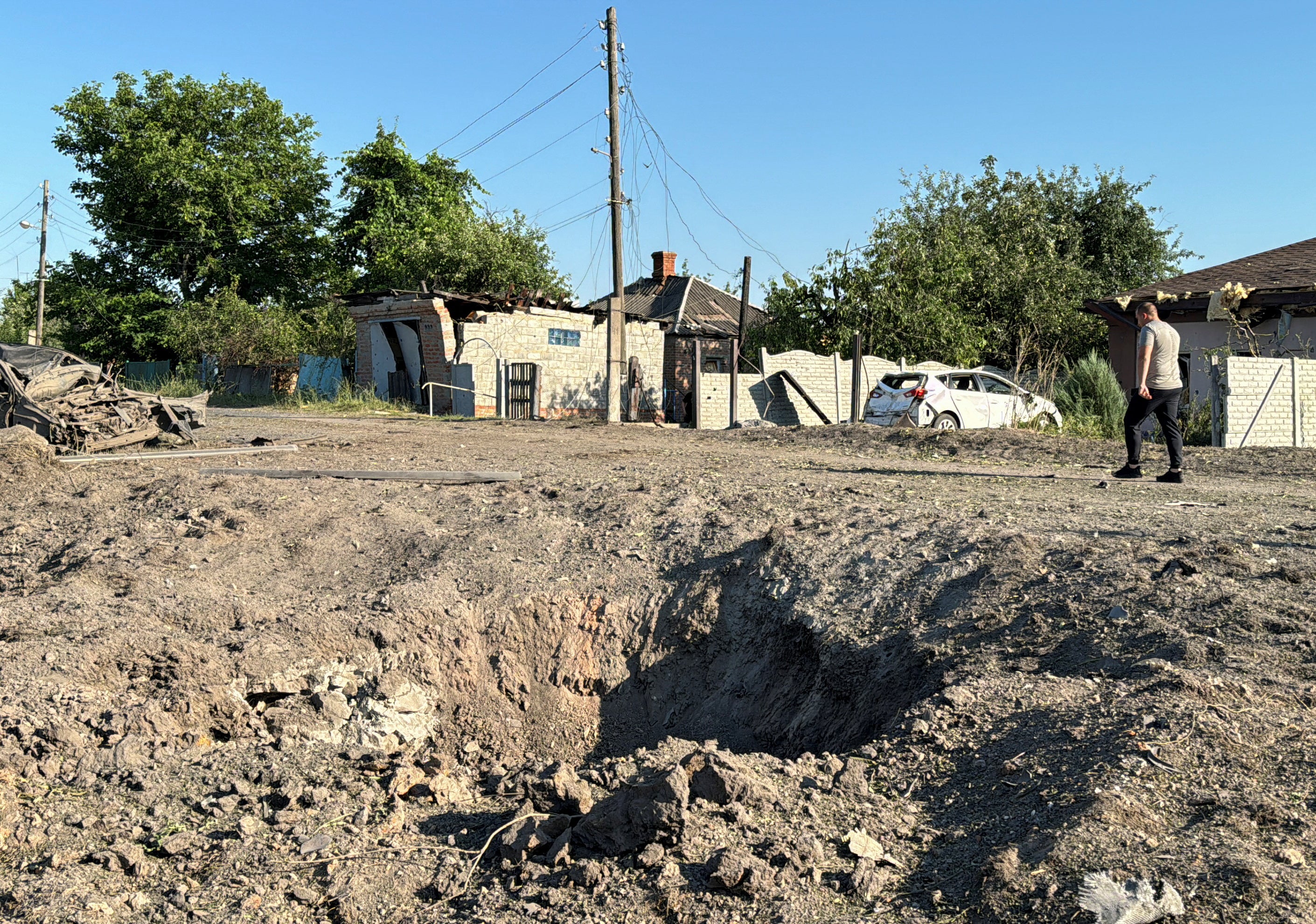 A view shows the site of a Russian missile strike, amid Russia's attack on Ukraine, in the village of Budy, Kharkiv region, Ukraine July 13, 2024.