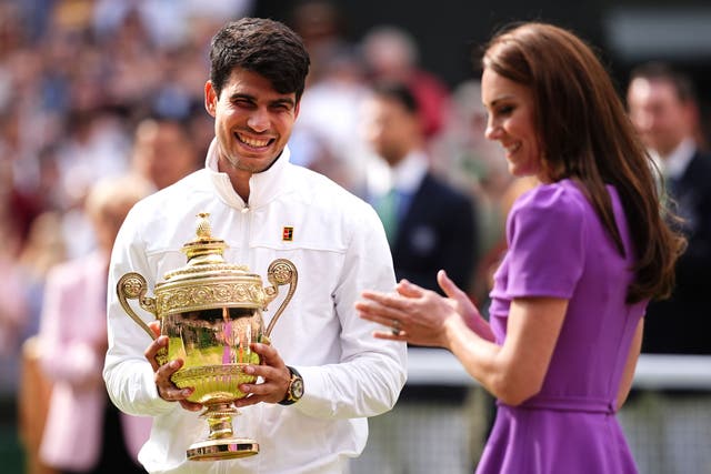 Carlos Alcaraz is presented with the trophy by the Princess of Wales (Aaron Chown/PA).