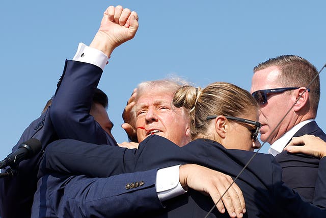 <p>Secret Service agents rush Donald Trump off a rally stage after he survived an assassination attempt on July 13. The agency has rejected false claims that his campaign was denied additional protections. </p>