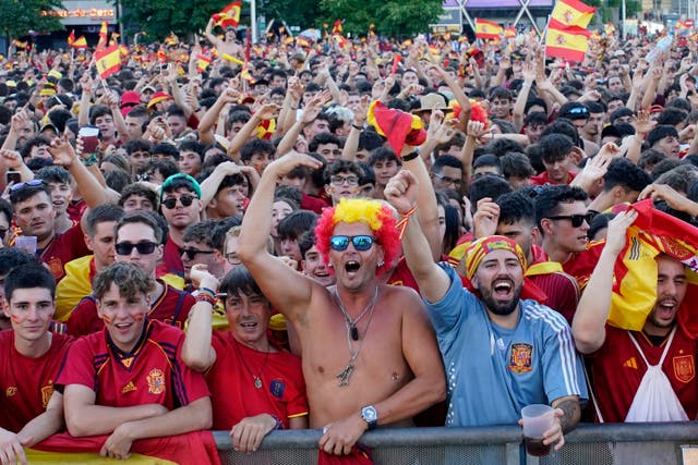 <p>Spanish fans in Madrid cheer their team</p>