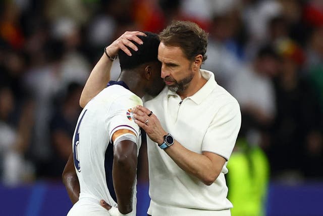 <p>Gareth Southgate consoles Marc Guehi after the England football team is beaten in the Euro 2024 finals </p>