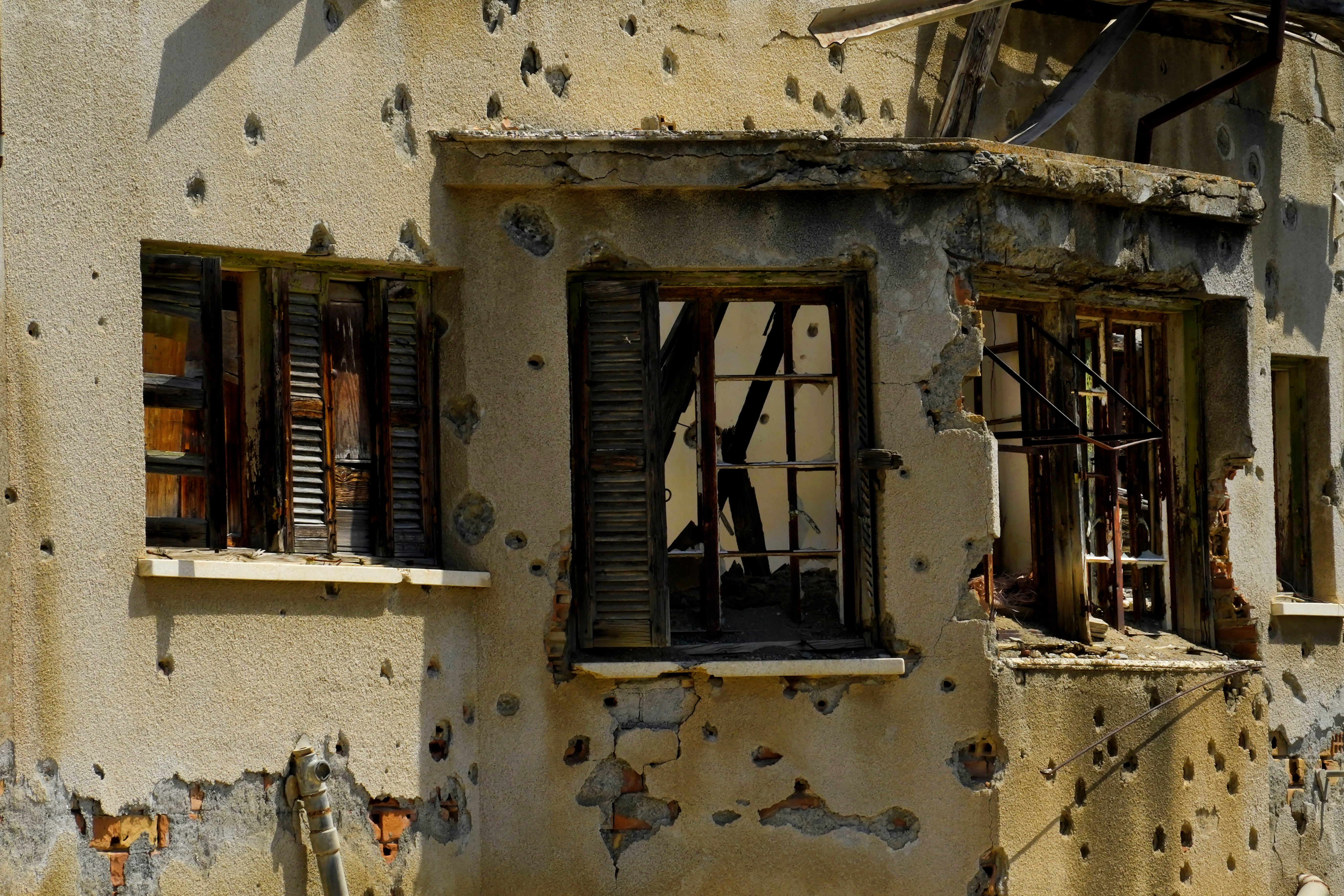 Bullet holes in an abandoned building inside the wartorn and divided capital of Cyprus: Nicosia