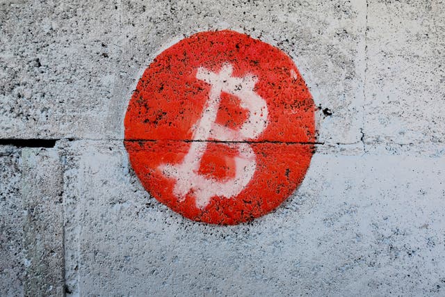 <p>A bitcoin logo is seen on the wall in Playa Blanca, El Salvador, on 11 January, 2024</p>