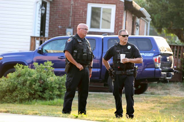<p>Bethel Park police officers talk outside the home of 20-year-old Thomas Matthew Crooks, named by the FBI as the “subject involved” in the attempted assassination of former President Donald Trump. An officer from Butler Township encountered Crooks on a rooftop shortly before he fired at the president, but retreated when Crooks pointed his gun at him.  </p>