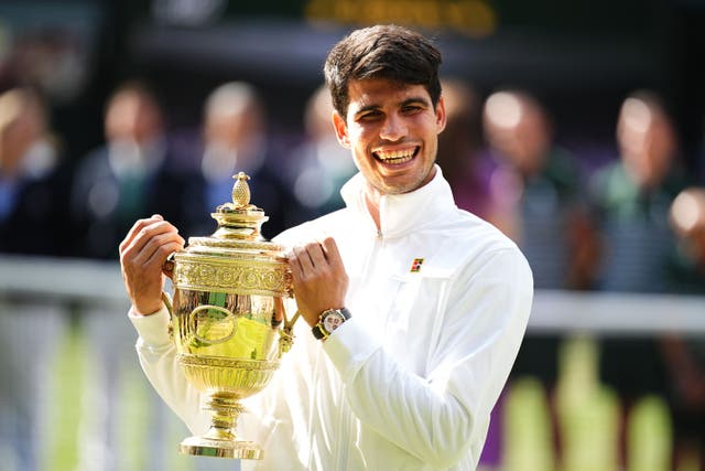 Carlos Alcaraz holds the Wimbledon trophy (Aaron Chown/PA)