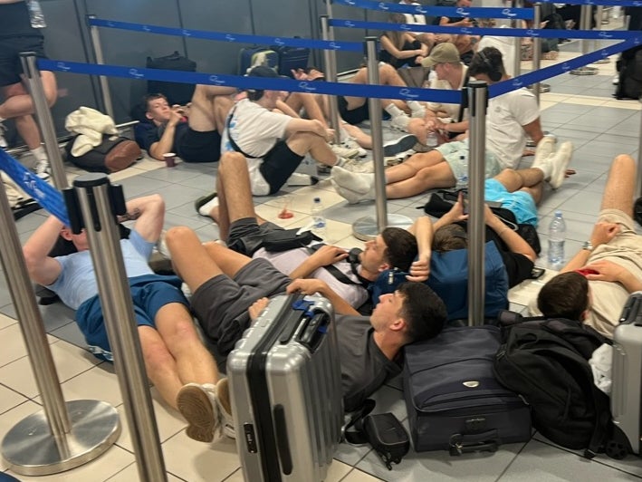 Down and out: passengers at Zante airport in Greece awaiting a delayed easyJet flight