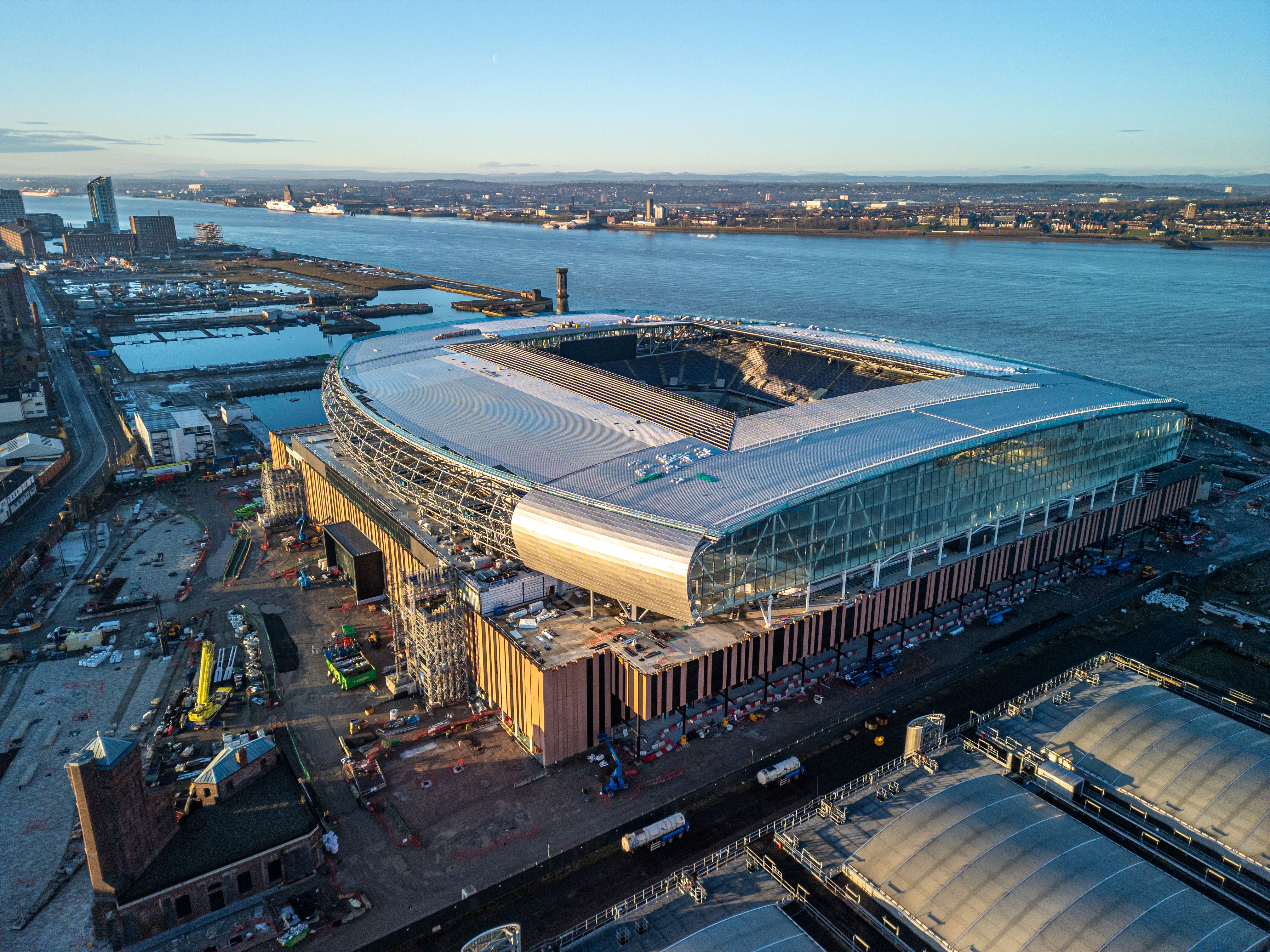 Everton’s new stadium, nearing completion, with the Central Docks in the background, the site of planned new development by Peel Waters. (Peel Waters/PA)