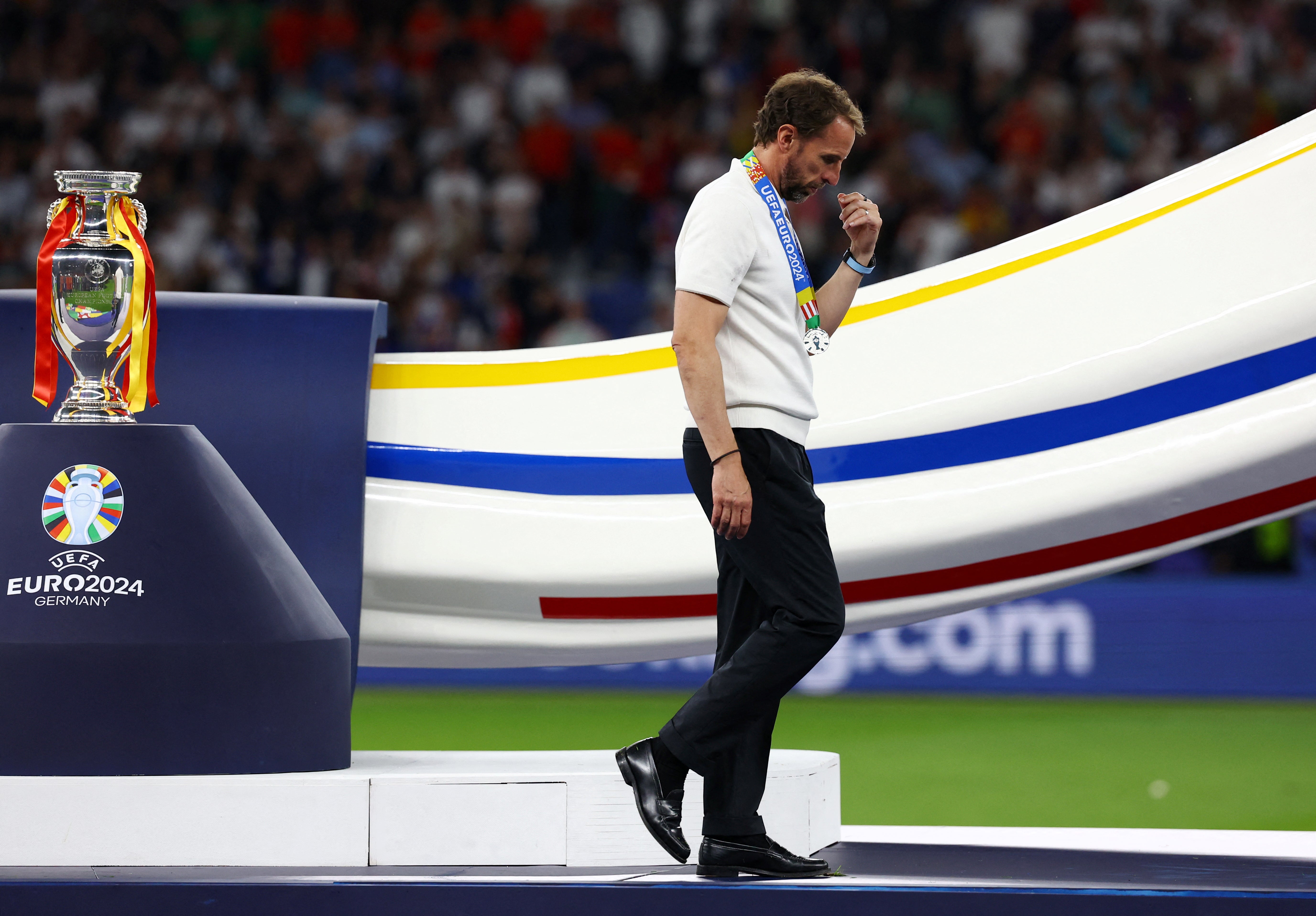 England manager Gareth Southgate looks dejected as he walks past the trophy