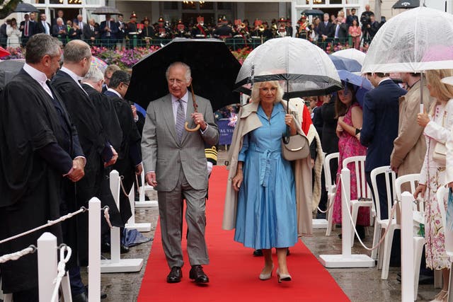 King Charles and Queen Camilla arrive at the Royal Square in St Helier, Jersey, for special sittings of the States Assembly and of the Royal Court, during their two day visit to the Channel Islands (Arthur Edwards/The Sun/PA)