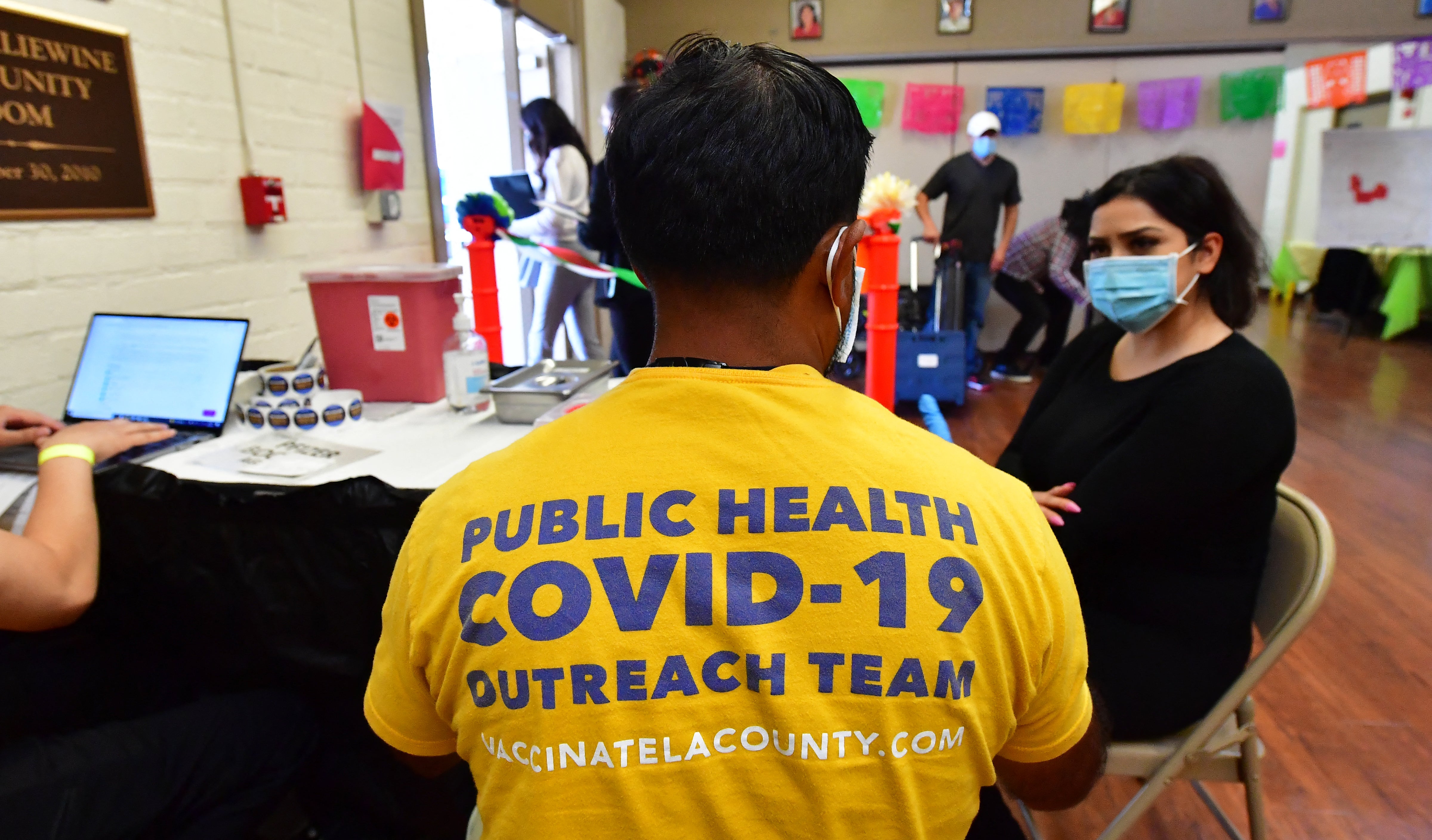 A woman receives a booster shot at a coronavirus vaccination center in Los Angeles in 2022. According to the CDC, coronavirus concentrations in wastewater in the United States reached 