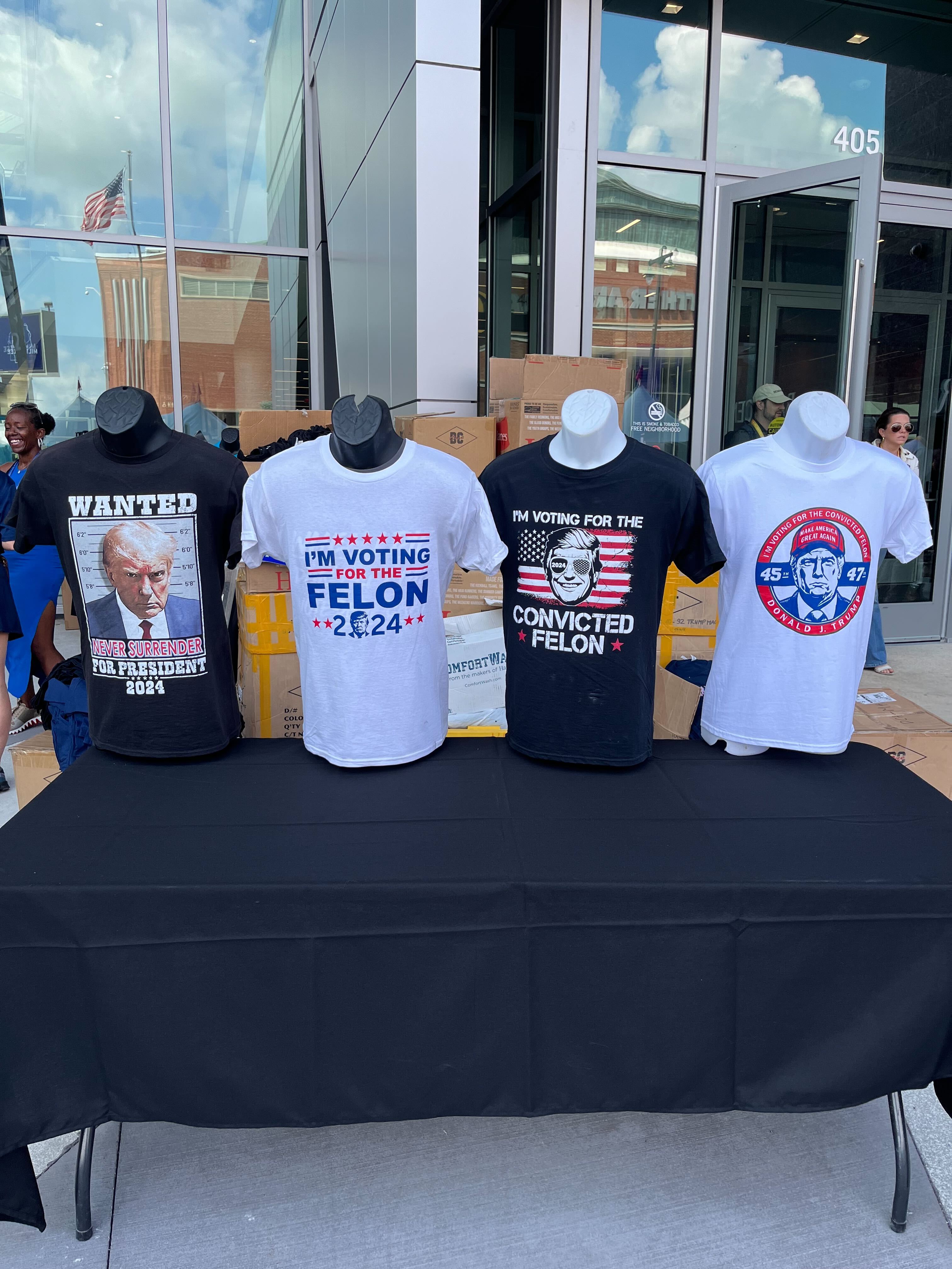 A merchandise stand at the RNC in Milwaukee sells felon-themed Trump T-shirts