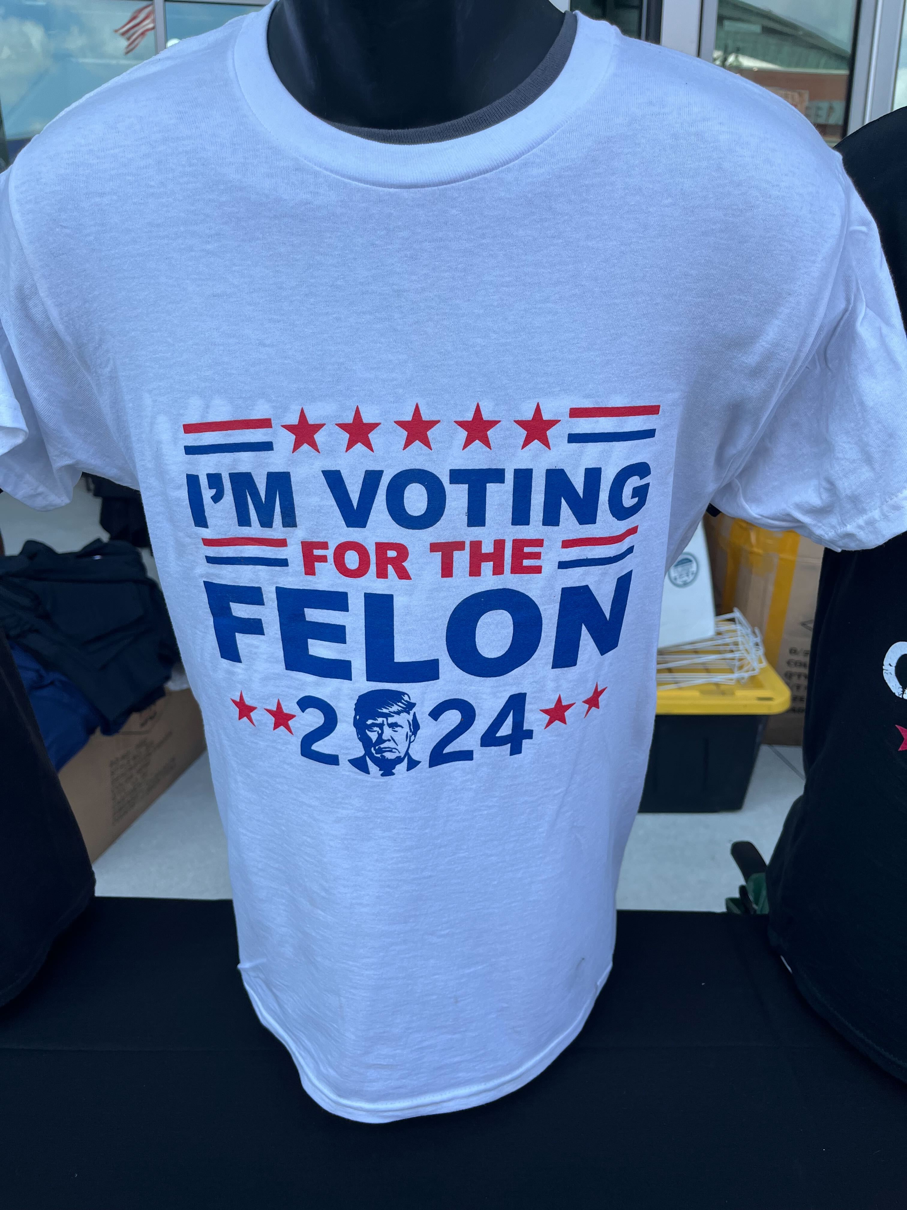 A merchandise stand at the RNC in Milwaukee sells T-shirts with the words ‘I’m voting for the felon 2024'