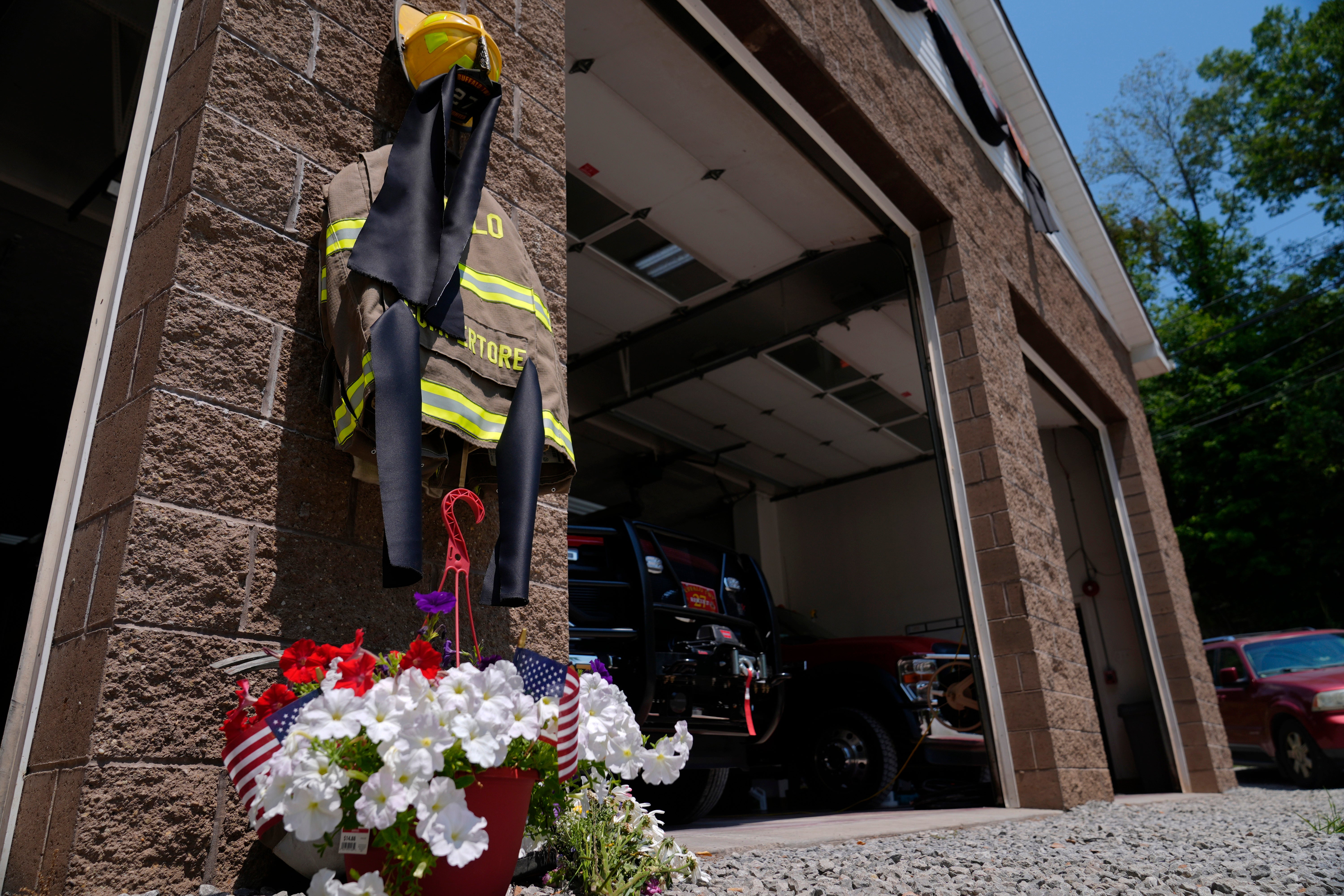 Flowers and a tribute to fallen firefighter Corey Comperatore are pictured at the Buffalo Township Volunteer Fire Station. There are public and private remembrances set for later in the week