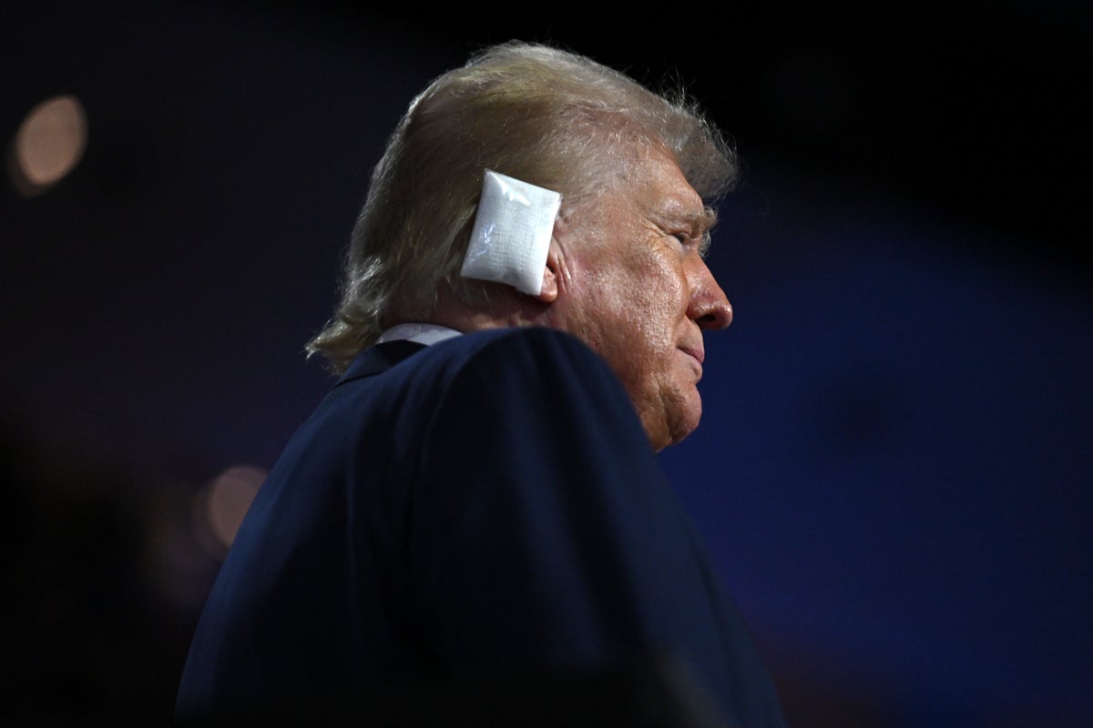 Trump appears emotional as he enters Republican convention with bandaged ear