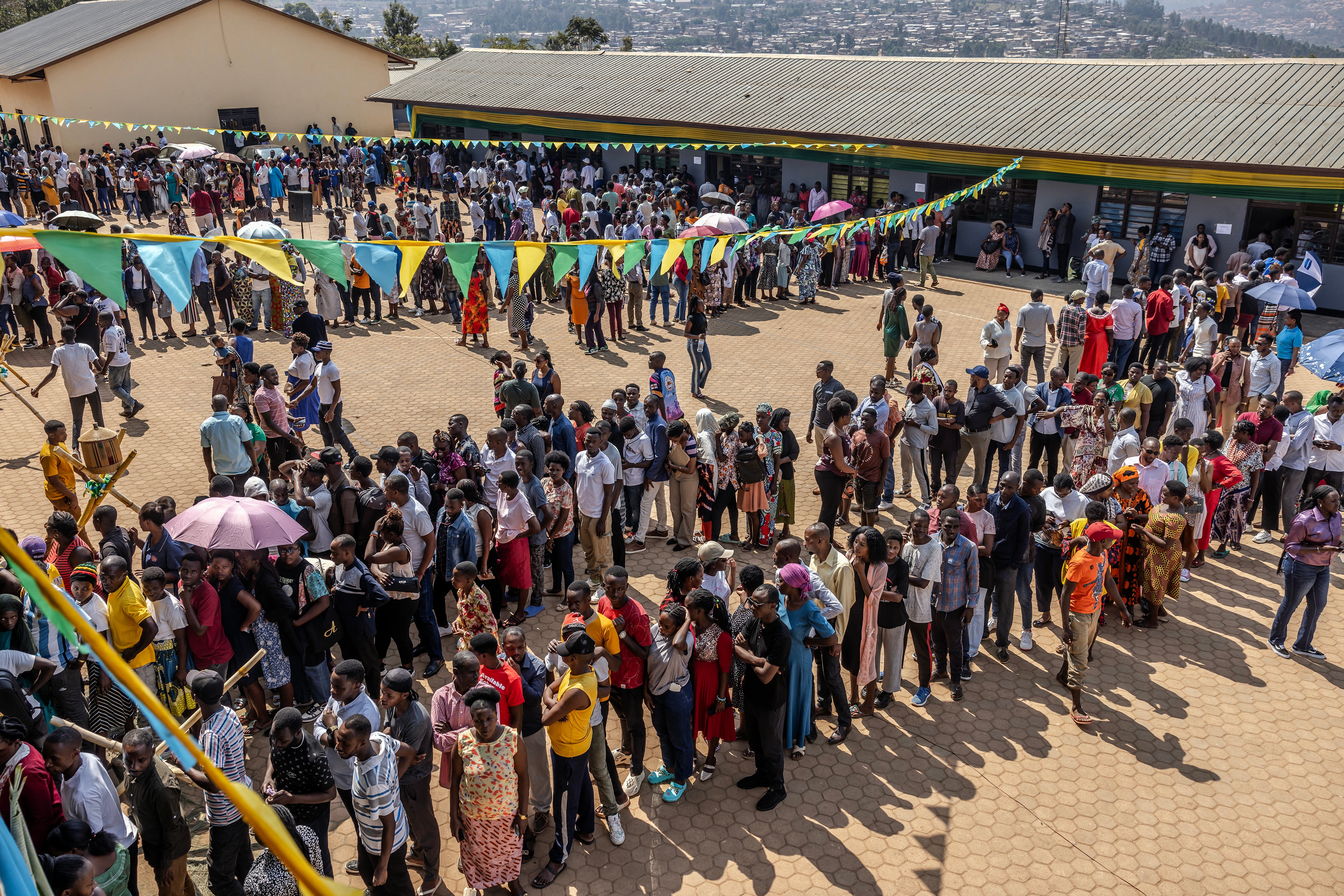 Rwandan voters queue up to cast their ballots at a polling station in Kigali on 15 July