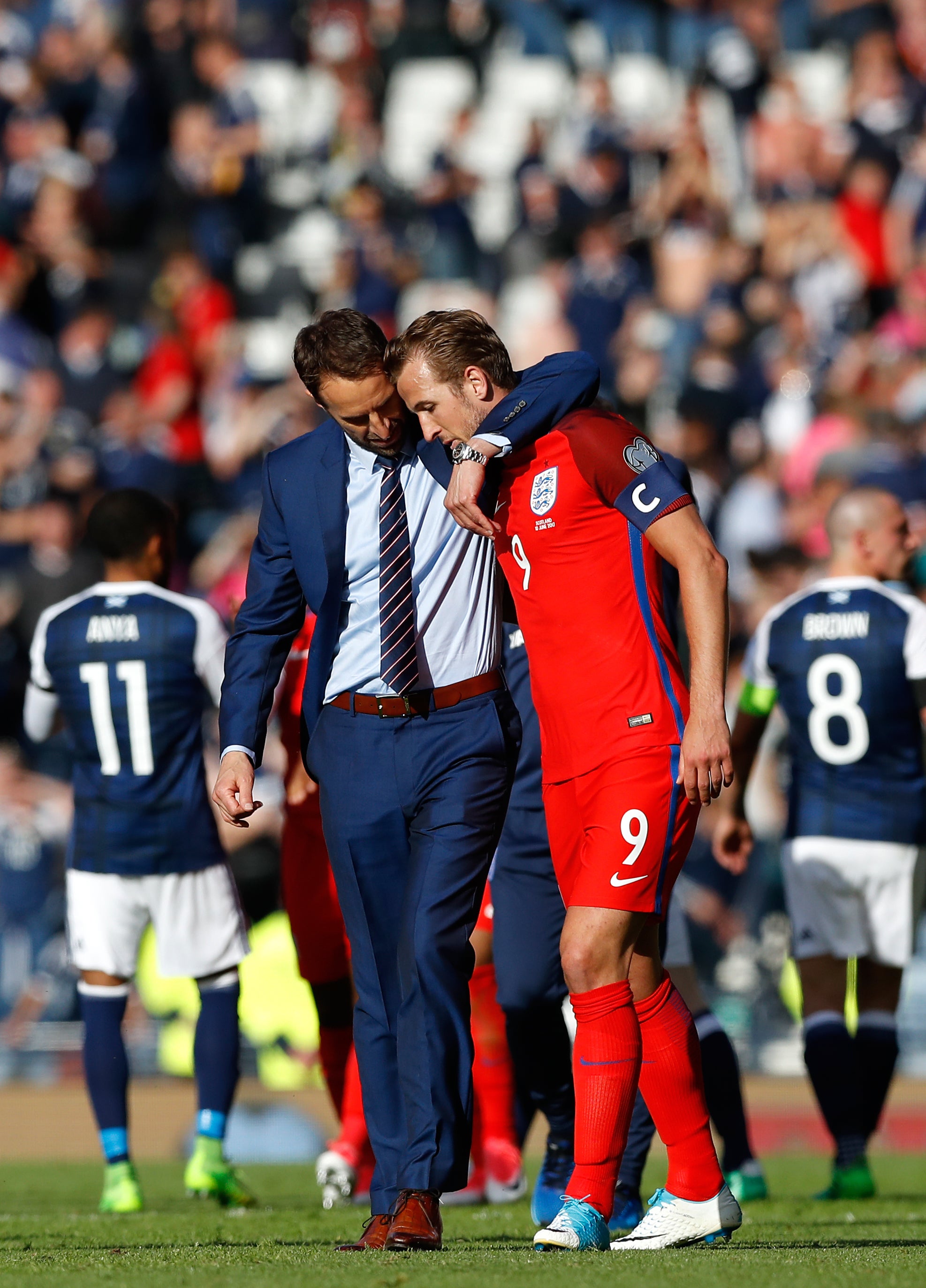 Southgate with Harry Kane, right, after the striker scored a stoppage-time equaliser to avoid a World Cup qualifying defeat against Scotland in June 2017 (Martin Rickett/PA)