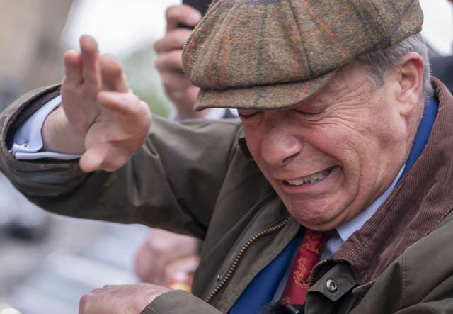 <p>Nigel Farage had objects thrown at him on the Reform UK campaign bus in Barnsley in the run-up to the General Election (Danny Lawson/PA)</p>