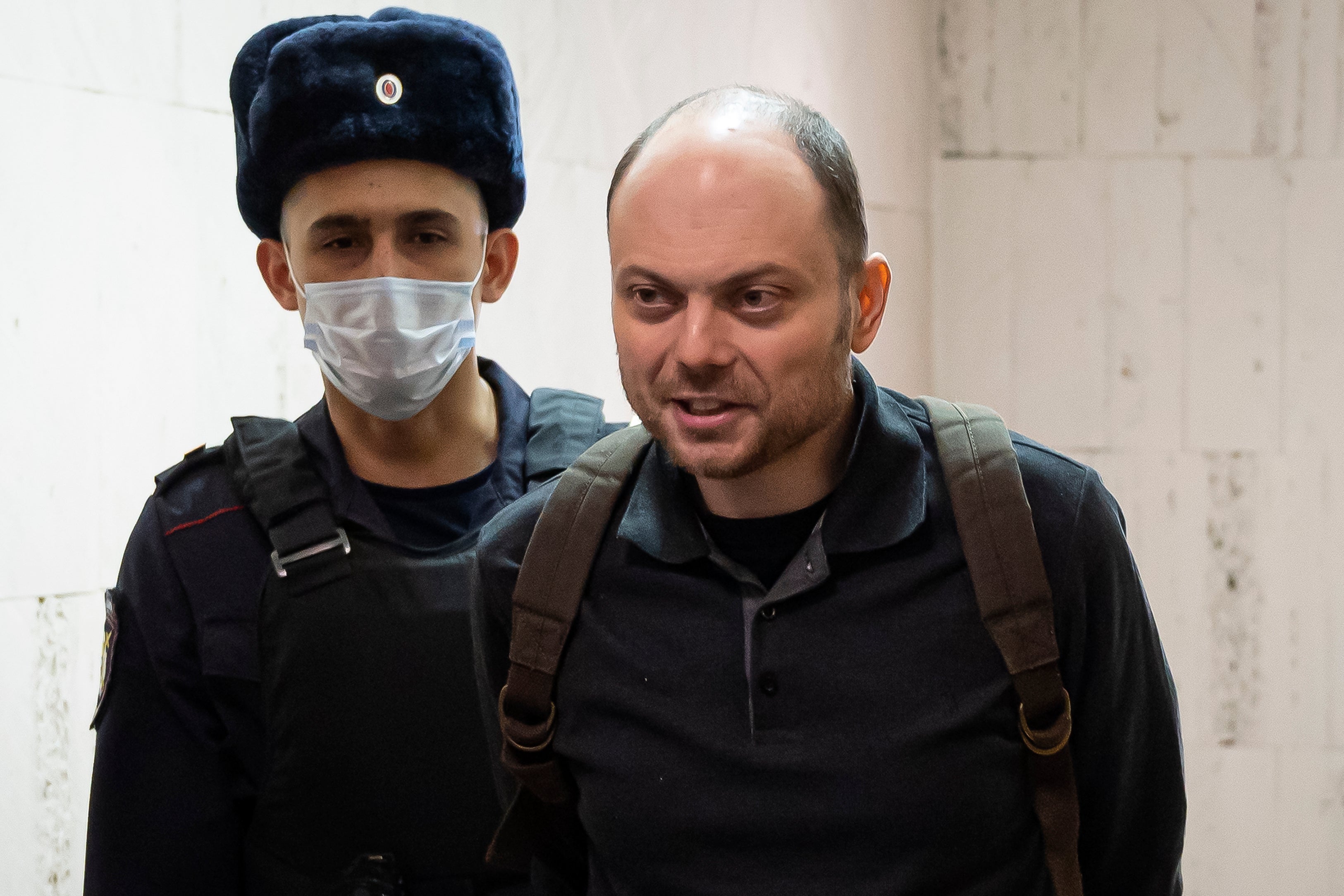 Russian opposition activist Vladimir Kara-Murza is escorted to a hearing in a court in Moscow, Russia