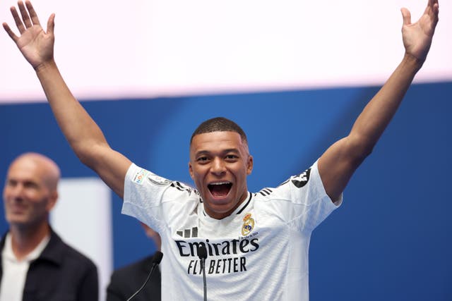 Kylian Mbappe gestures to Real Madrid fans at his unveiling (Isabel Infantes/PA)