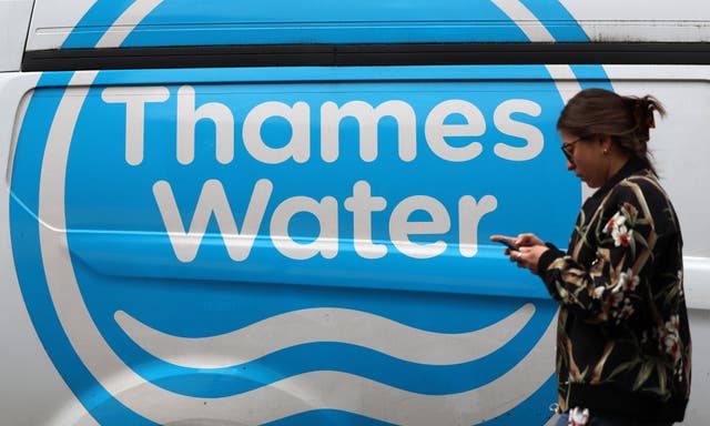<p>A pedestrian passes a Thames Water vehicle in London, Britain, 12 July 2024.</p>