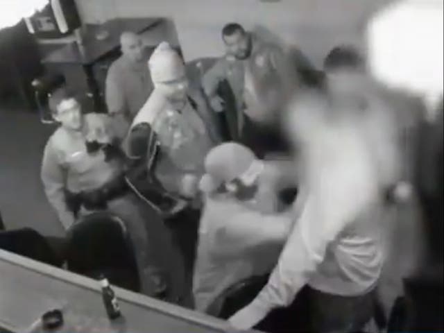 <p>Surveillance footage shows Frank Deluca of the Pagans Motorcycle Club fighting with an undercover Pittsburgh police officer inside Kopy’s bar</p>