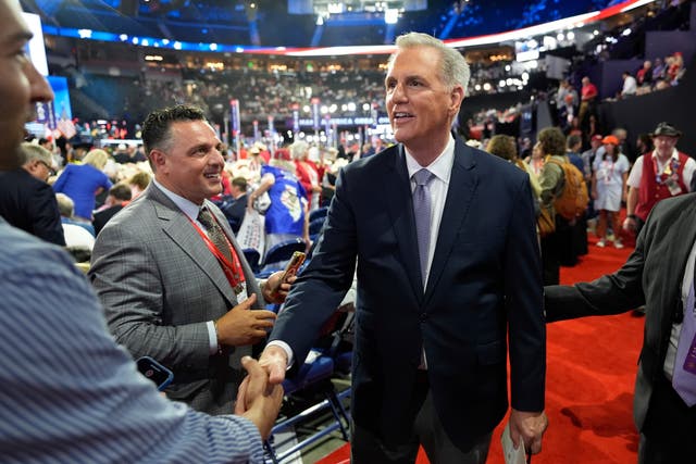 <p>Kevin McCarthy, pictured, shakes hands with a delegate at the Republican National Convention on Monday. The former speaker falsely claimed there has not been an attempted presidential assassination since the 1960s during a speech on Tuesday</p>