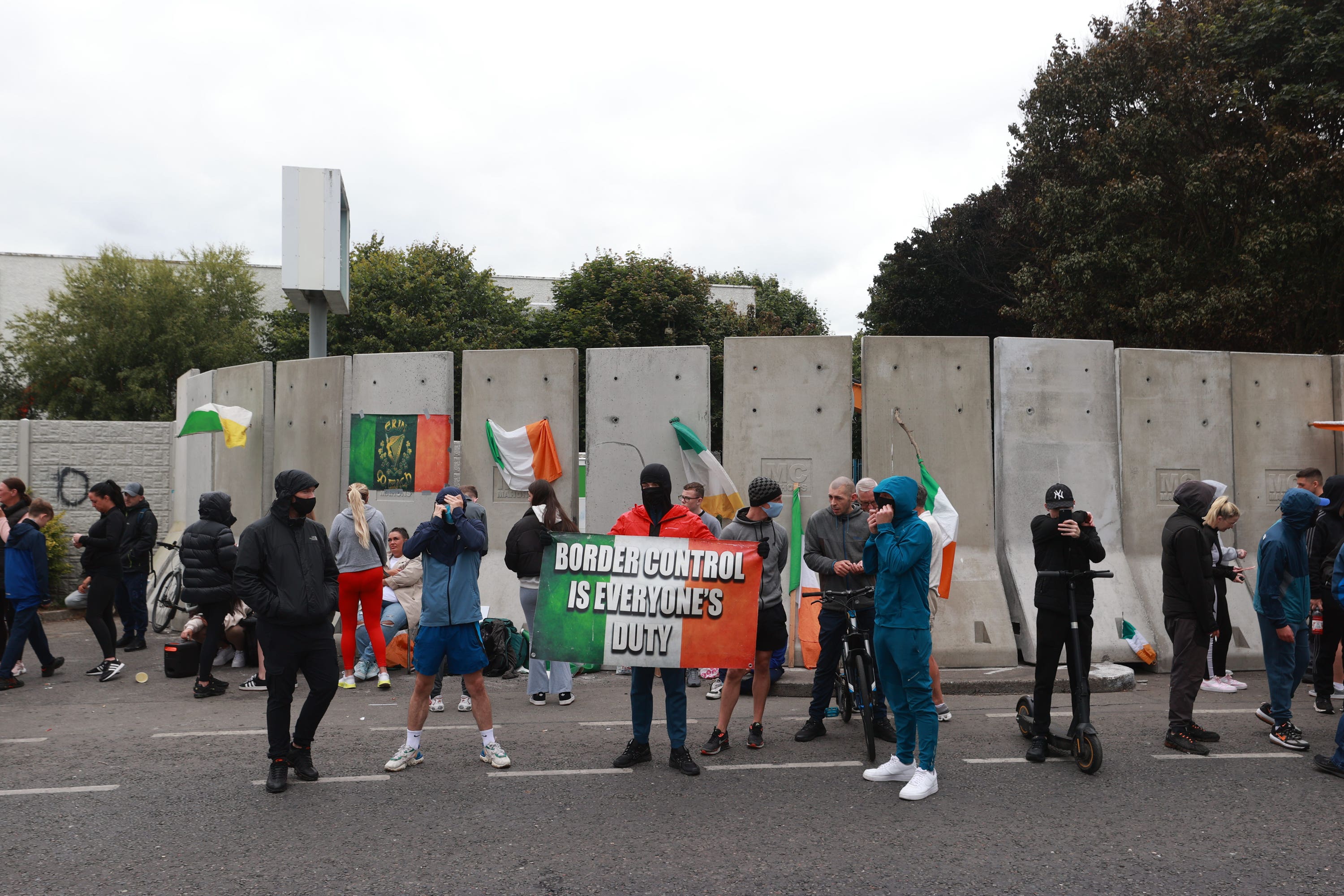 Protesters gather at the former Crown Paints factory in Coolock, north Dublin on Tuesday (Liam McBurney/PA)