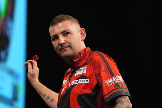 Defending champion Nathan Aspinall is out of the World Darts Matchplay (Martin Rickett/PA)