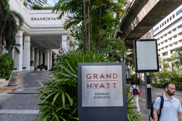 <p>People walk past the main entrance of the Grand Hyatt Erawan hotel in Bangkok on July 17, 2024</p>