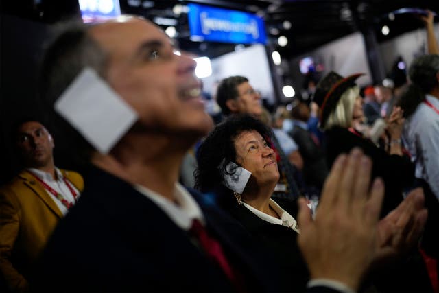 <p>Arizona delegate Joe Neglia and Stacey Goodman sport ear bandages in support of Trump at the RNC </p>