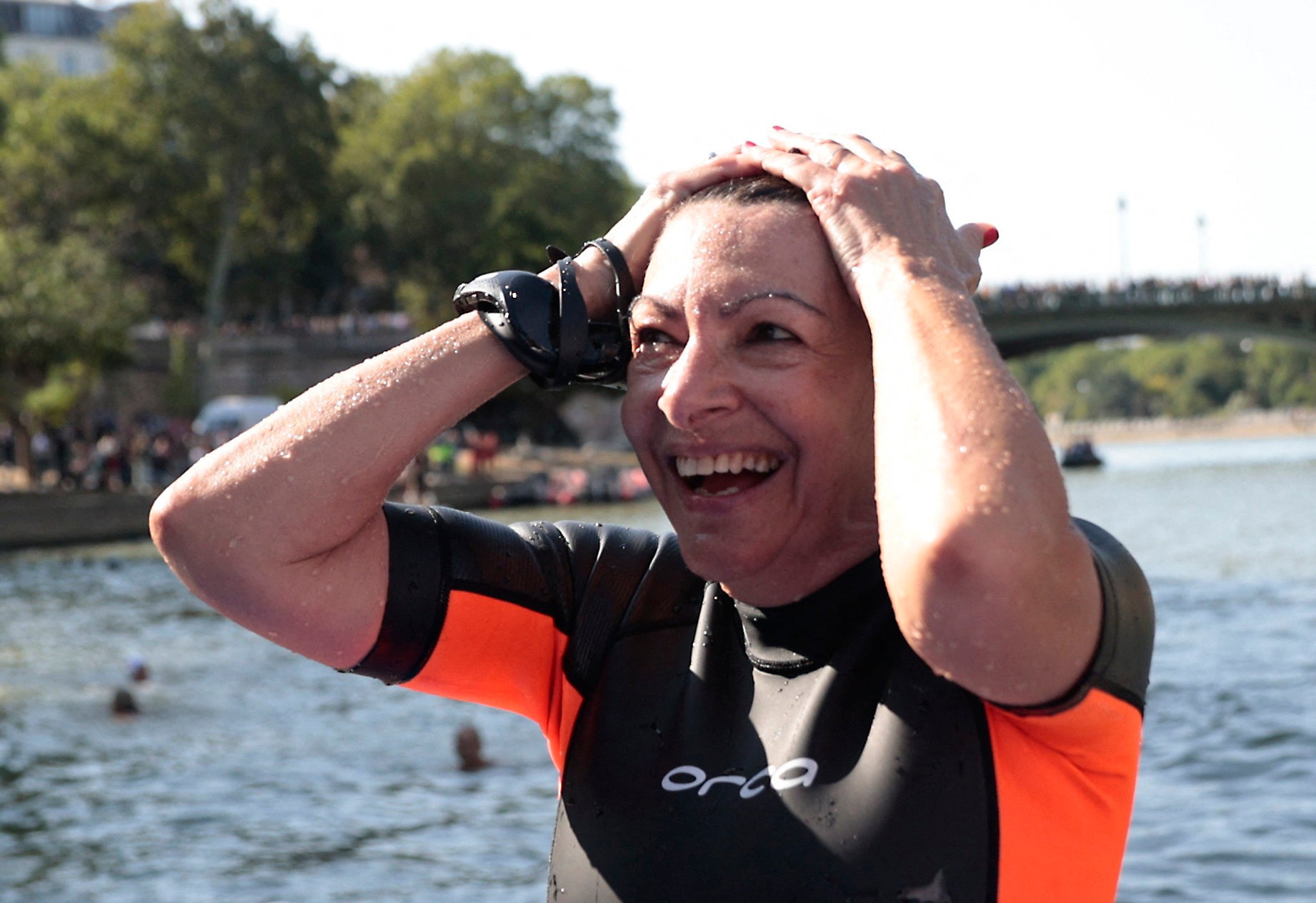 Mayor of Paris Anne Hidalgo emerges from the River Seine after taking a plunge