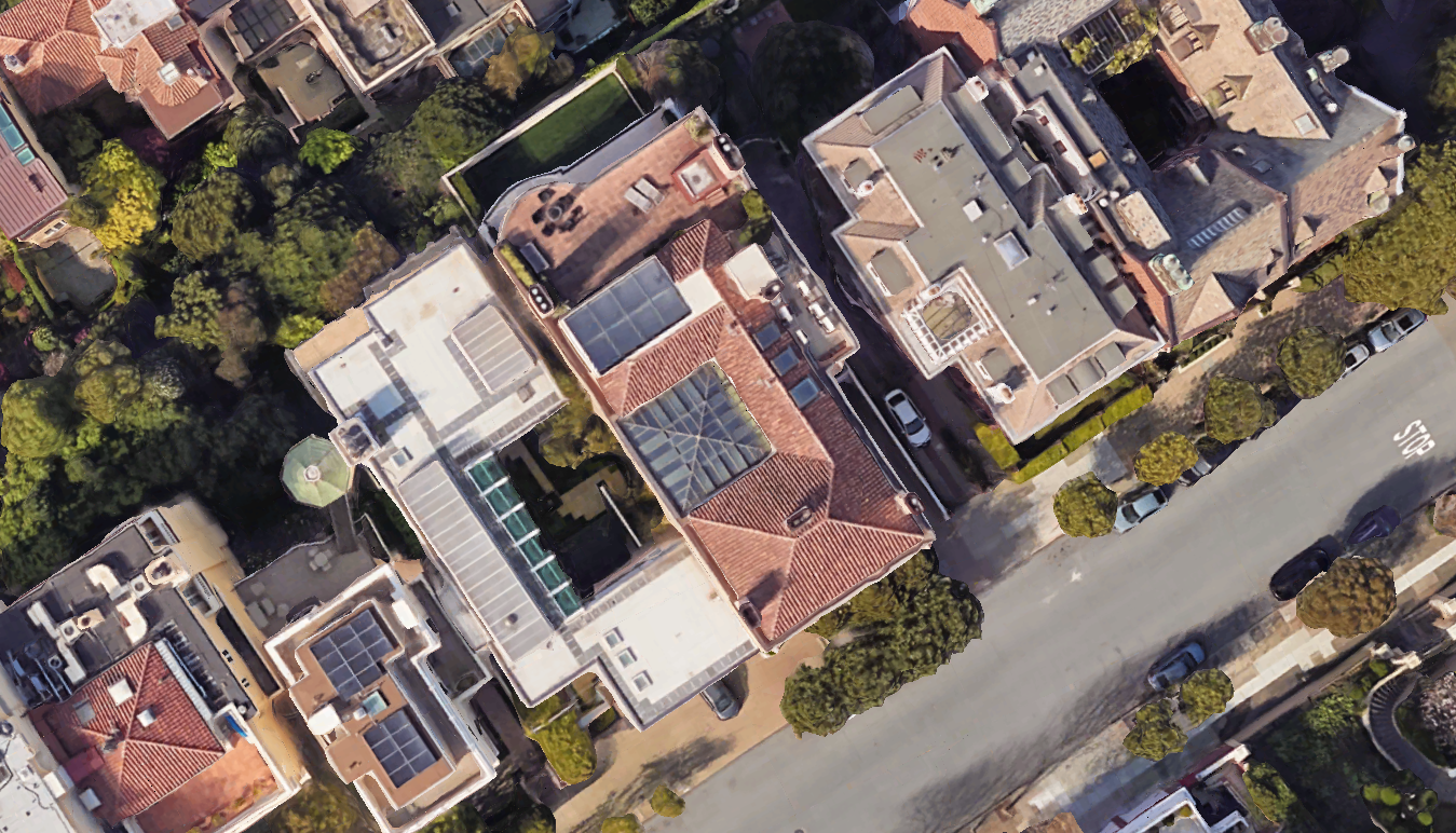 Aerial images of the house today show the property with vast areas of outdoor space, including a roof deck and a second-floor balcony