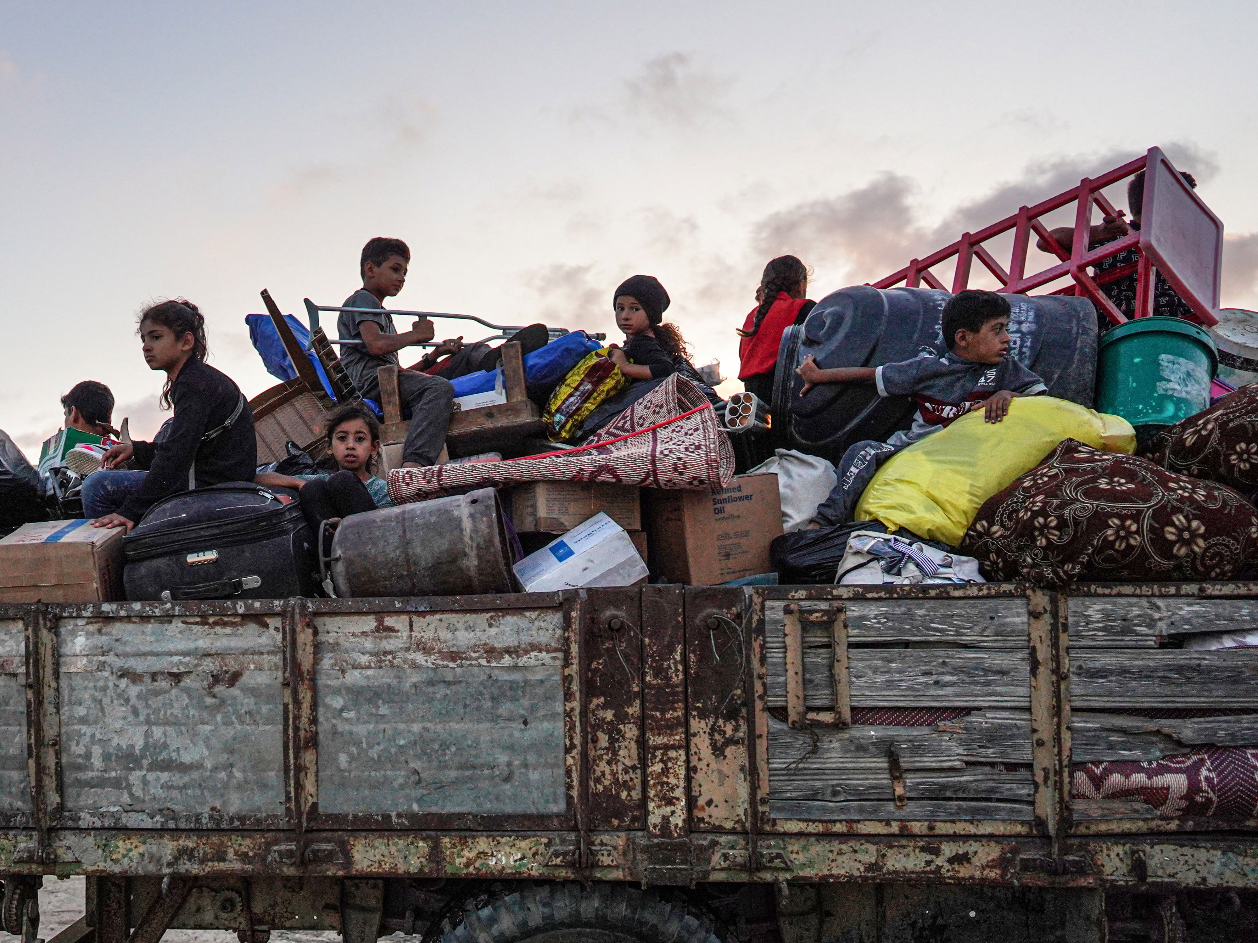 <p>Palestinians leave east Khan Yunis after the Israeli army issued a new evacuation order on 1 July 2024</p>