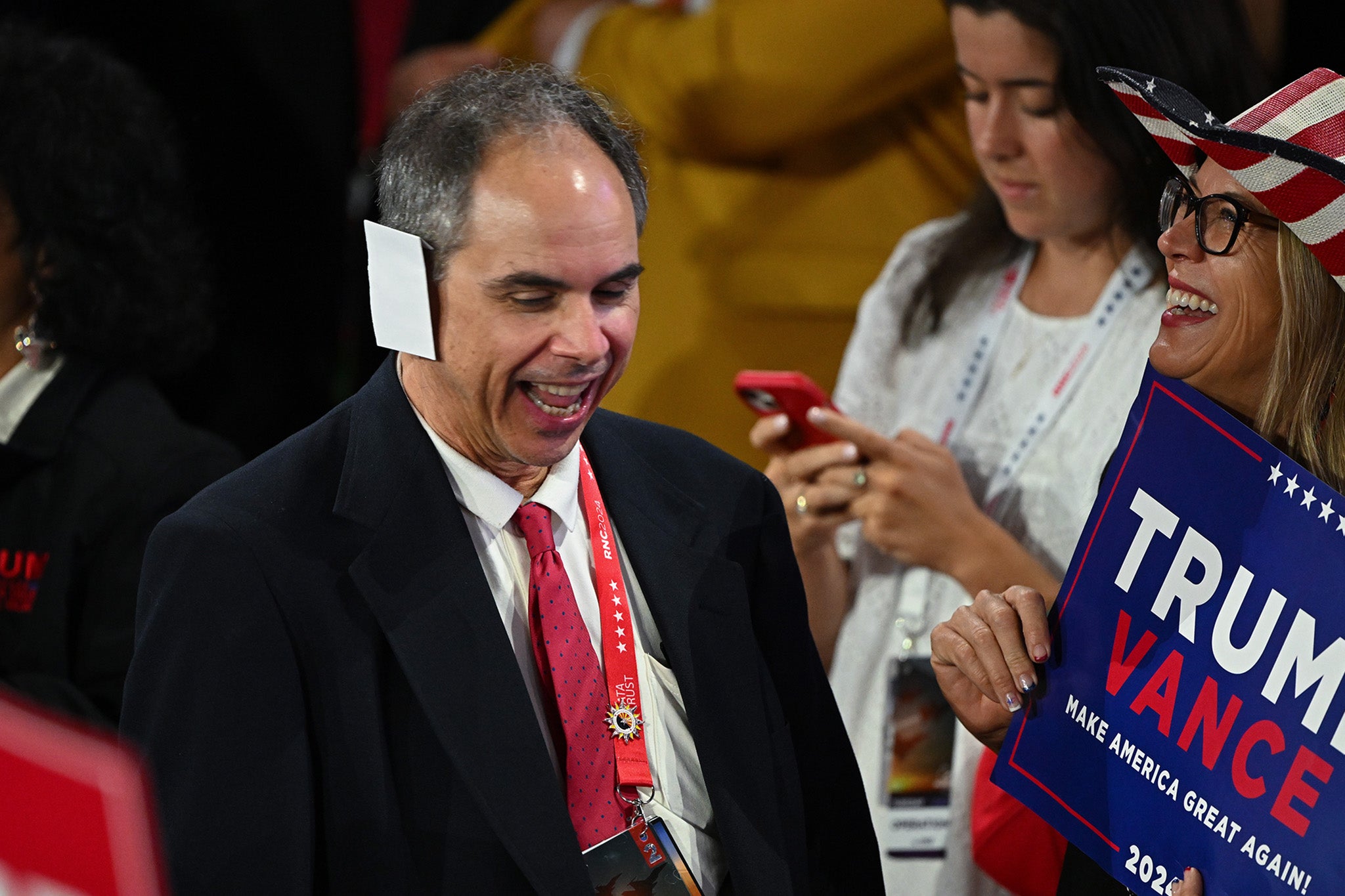 Arizona delegate Joe Neglia fashioned his ‘bandage’ out of paper. Ear bandages – in honor of Trump’s wound suffered in an assassination attempt – became a must-wear fashion item at the event