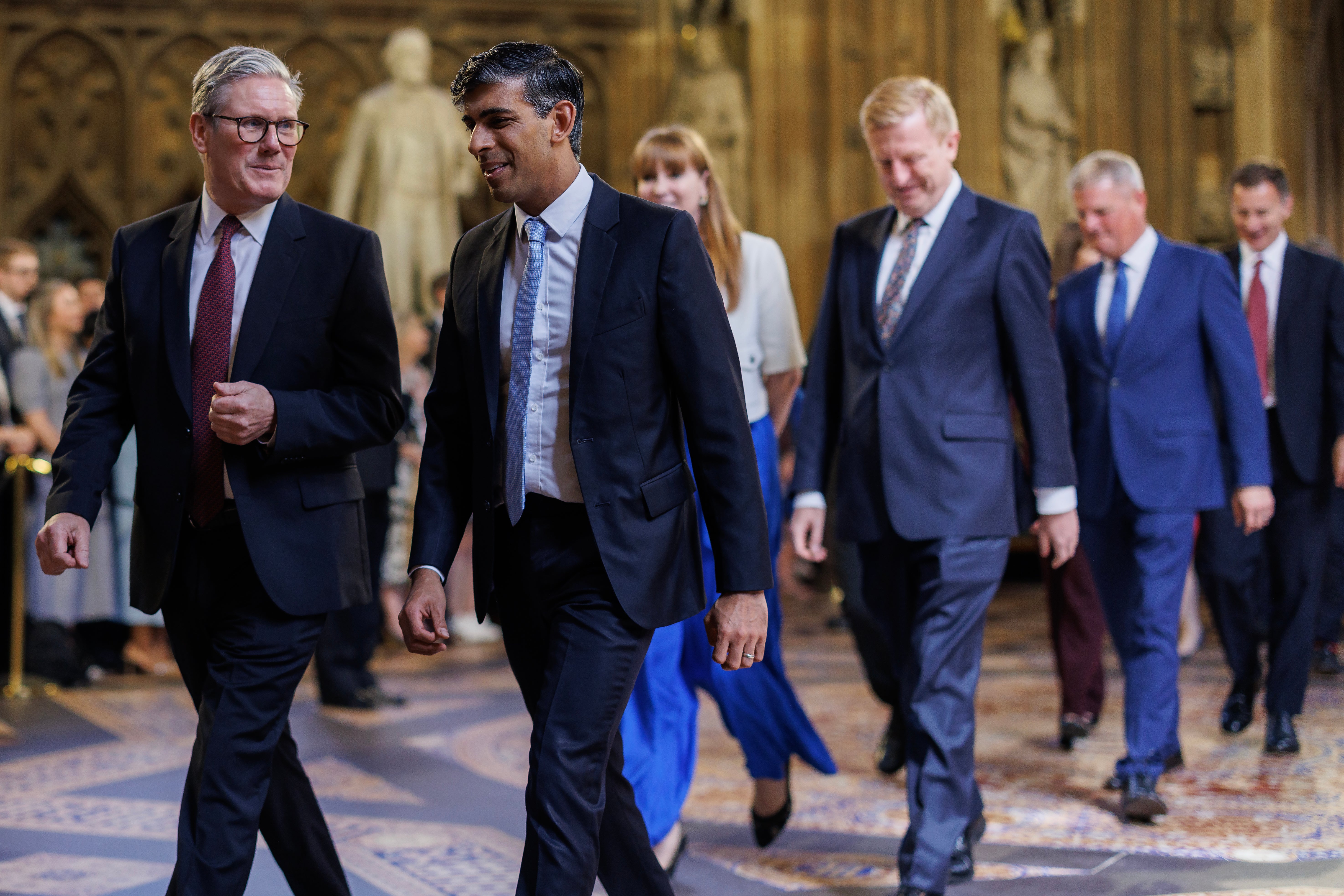 Prime Minister Sir Keir Starmer (left) and former prime minister Rishi Sunak (right) lead MPs through the Central Lobby of the Houses of Parliament in London to the House of Lords to hear the King's Speech during the State Opening of Parliament. Picture date: Wednesday July 17, 2024