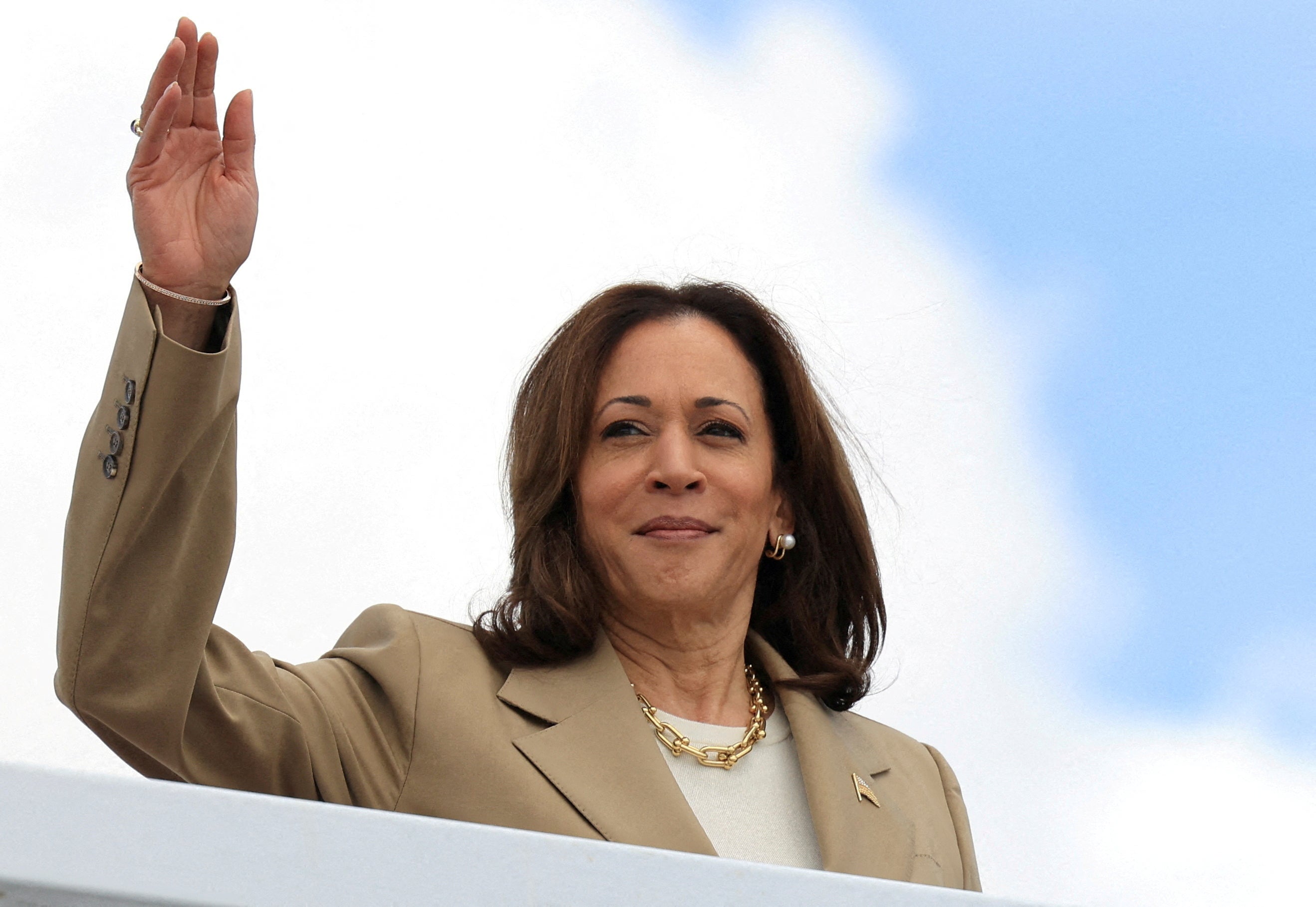 Vice President Kamala Harris waves as she boards Air Force Two to depart on campaign travel to Philadelphia, Pennsylvania on July 13.