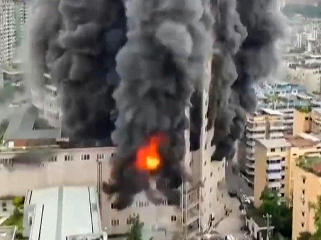 <p>A fire tearing through a shopping centre in Zigong, China</p>