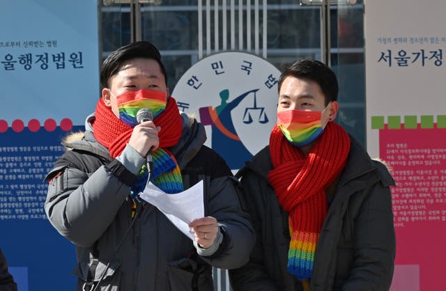 <p>File South Korean same-sex couple So Seong-wook (L) and Kim Yong-min (R) attend a press conference as they file a lawsuit against the National Health Insurance Service for their dependent family status</p>