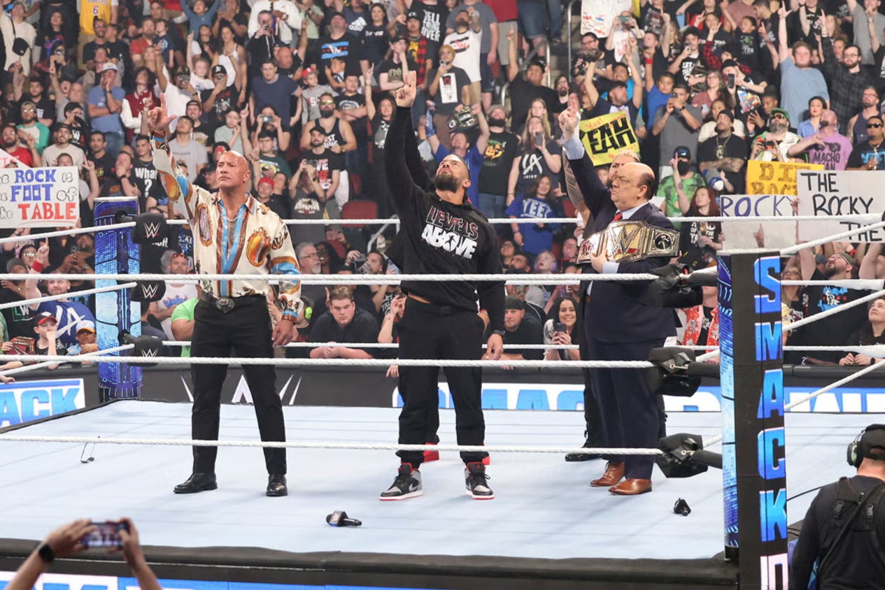 The Rock (left) with Roman Reigns (centre) before this year’s WrestleMania