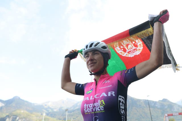 <p>Fariba Hashimi of Afghanistan celebrates after winning the 2022 Women’s Road Championships of Afghanistan in Aigle, Switzerland</p>