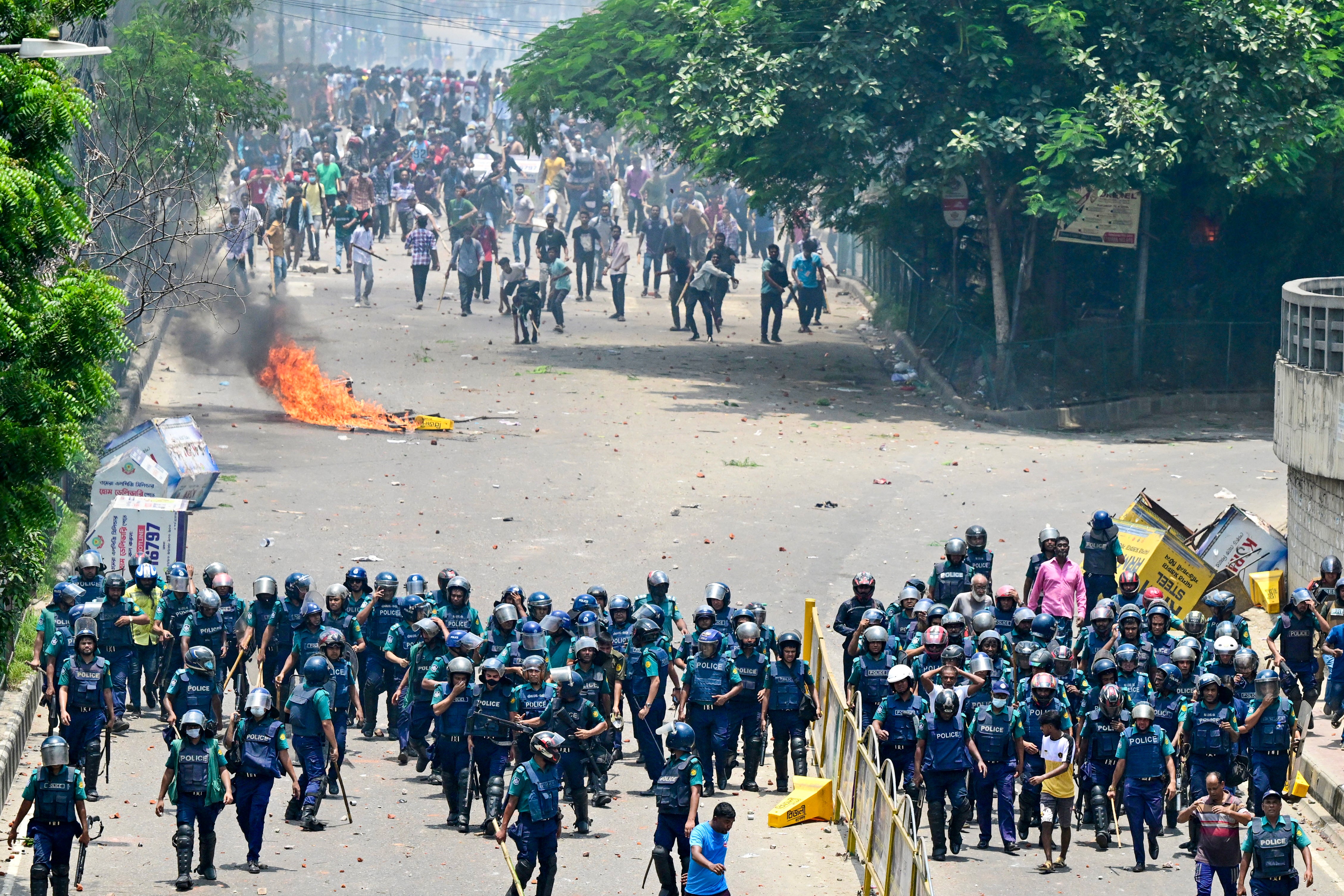 <p>Anti-quota protesters clash with the police in Dhaka on 18 July</p>