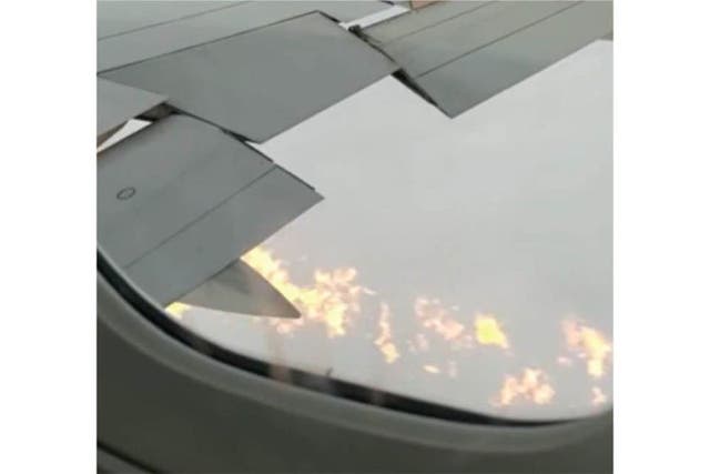 Flames could be seen under the wing of the plane (AAIB/PA)