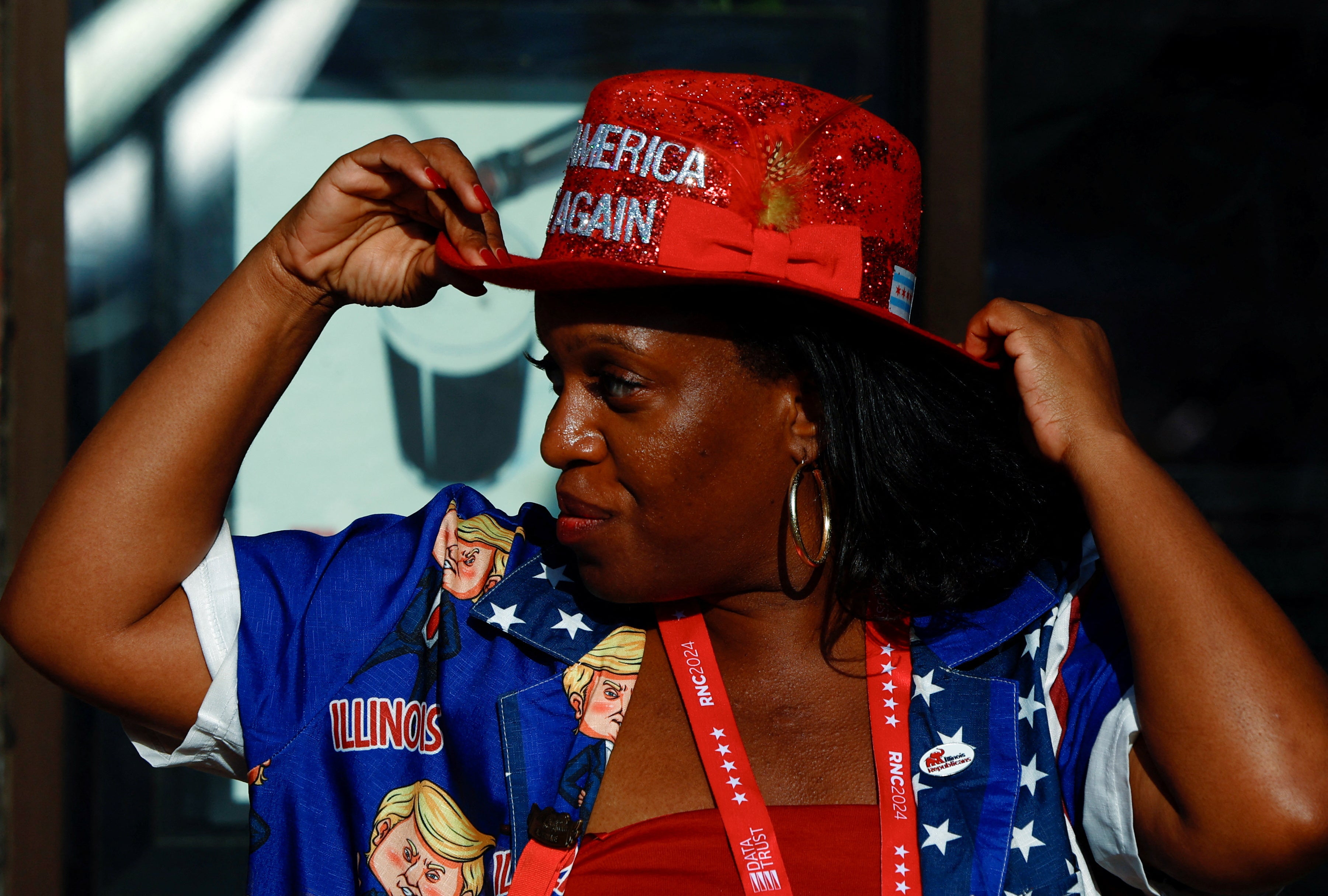 A Trump supporter adjusts her red glitter MAGA hat outside the Fiserv Forum