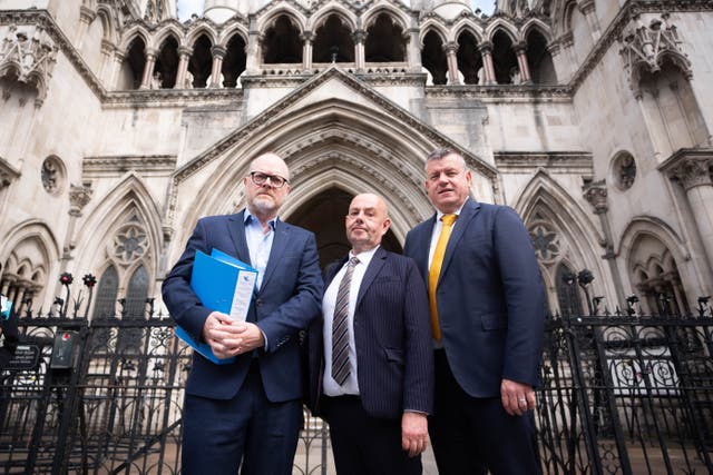 Journalists Trevor Birney, Barry McCaffrey and their lawyer Niall Murphey, outside the Royal Courts of Justice, in London (James Manning/PA)